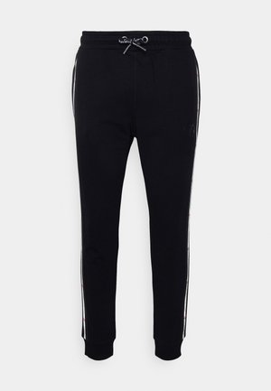 JOGGER UNISEX - Trainingsbroek - schwarz