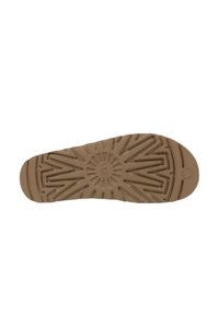 Suola di scarpa in gomma di colore marrone chiaro, con un motivo testurizzato a zigzag e un emblema circolare al centro. Presenta una scanalatura definita per la presa.