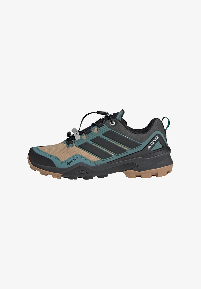 Trailrunningschuh mit einem schwarzen und braunen Mesh-Obermaterial, türkisen Akzenten und einer robusten Gummisohle mit tiefen Stollen für besseren Halt.