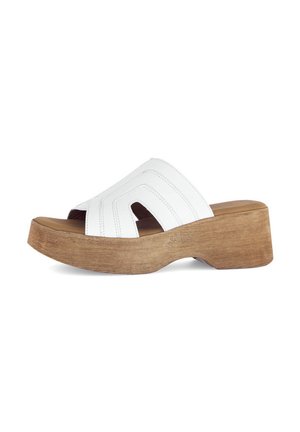 White leather sandal with cross-strap design, open toe, and wooden platform sole with textured finish.