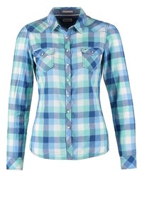 Camicia a scacchi blu e verde con maniche lunghe, chiusura frontale con bottoni, due tasche sul petto e orlo curvo. Realizzata in tessuto di cotone leggero.