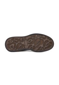 Shoe sole with a textured brown rubber surface featuring a unique pattern of curves and cutouts, bordered by a black rim.