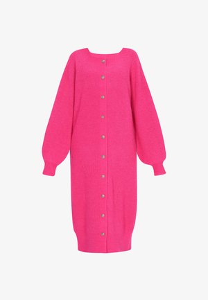 Rózsaszín kötött kardigán négyzet alakú nyakkivágással, hosszú ballon ujjakkal és elöl gombokkal. Bordás mandzsettákkal és függőleges részletezéssel rendelkezik.