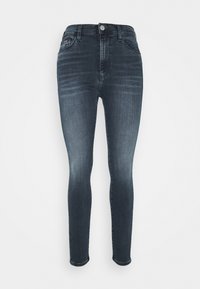 Tmavě vyprané skinny džíny s vysokým pasem, vyrobené z denimu, s jemným blednutím, klasickým pětipocketovým designem a kovovým zapínáním na knoflík.