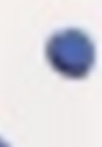 Blue circular button positioned on a light-colored surface, featuring a smooth texture and unobtrusive design.