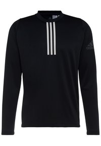 Camisa deportiva de manga larga negra con cuello redondo, tres rayas verticales blancas en el pecho y un logo de Adidas en la manga.