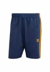 FIREBIRD - Tracksuit bottoms - night indigo   crew orange