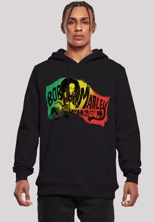 Black hoodie featuring a graphic print of Bob Marley playing guitar, with red, yellow, and green accents on a distressed background.
