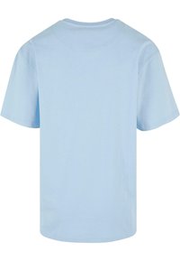Light blue cotton t-shirt with a round neckline and short sleeves. The fabric is smooth, with a plain design and no distinct patterns or accents.