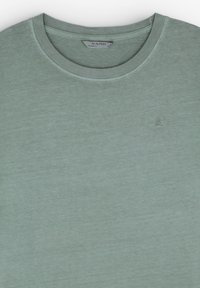 Light green t-shirt with a round neck, made from soft material. Features a small logo embroidered on the chest. Smooth texture.