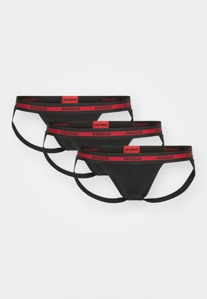 Drei schwarze Slips mit rotem HUGO-Logo-Bund. Glatte Textur, elastische Träger, minimalistisches Design und taillierte Form.