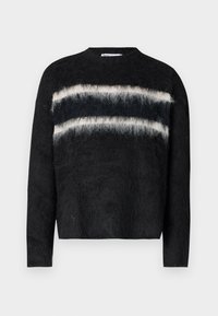 Black sweater with long sleeves, featuring a textured finish and three horizontal stripes: two dark blue and one white. Round neckline.