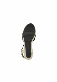 Sandal with a black upper, beige textured sole, adjustable strap, and rubber tread pattern for grip. Marked size 37.
