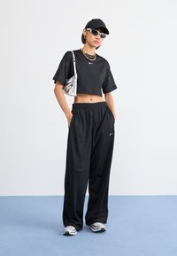 Nike Sportswear PANT COORD - Donji dijelovi trenirke - black