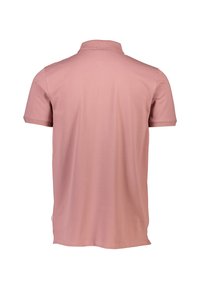 Polo a maniche corte di colore rosa chiaro, realizzato in tessuto morbido. Presenta un colletto e una vestibilità dritta e rilassata. Nessun motivo o dettaglio visibile.