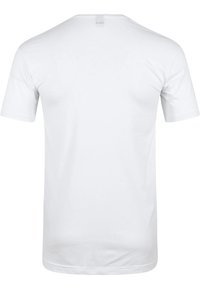 Witte katoenen t-shirt met korte mouwen, ronde hals en rechte snit. Minimalistisch ontwerp, zonder zichtbare patronen of accenten.