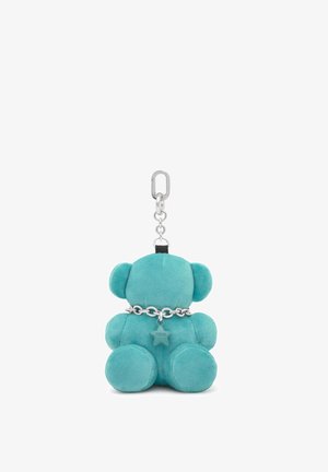Portachiavi a orsetto in peluche turchese con collarino a catena argentata e un ciondolo a forma di stella, mostrato di spalle su sfondo bianco.