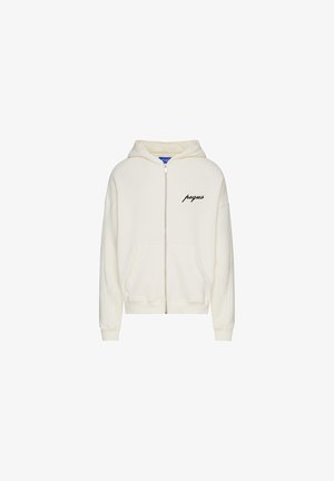 Cream hoodie with a zip front, drawstring hood, long sleeves, and front pockets. Features a black "pegus" print on the left chest.