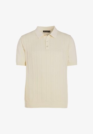 Kortærmet polo i cremefarve med lodret ribstrikket mønster og tre knapper i stolpen.