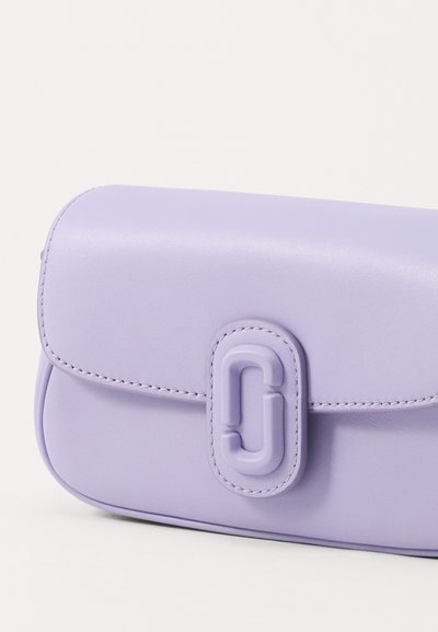 Lavender leather bag with rounded edges, featuring a prominent clasp in the shape of a "C" and subtle stitching along the edges.