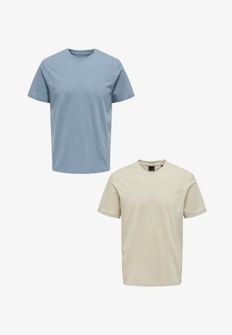 Two t-shirts: one light blue and one beige. Both are short-sleeved, round-neck, made of cotton, with a smooth texture and no patterns.