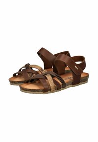Brown sandals with crossover straps made of smooth leather and textured cork. Adjustable ankle strap and cushioned footbed with a cork sole.