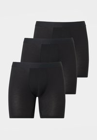 Τρία μαύρα ανδρικά μπόξερ με ελαστικές μέσες, τοποθετημένα σε εναλλασσόμενη σειρά σε ανοιχτό γκρι φόντο.