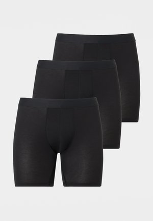 Three black men's boxer briefs with elastic waistbands, arranged in a staggered row on a light gray background.