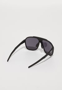 Black sunglasses with a rectangular design, matte frame, gray tinted lenses, and textured arms displaying the brand "Bliz."