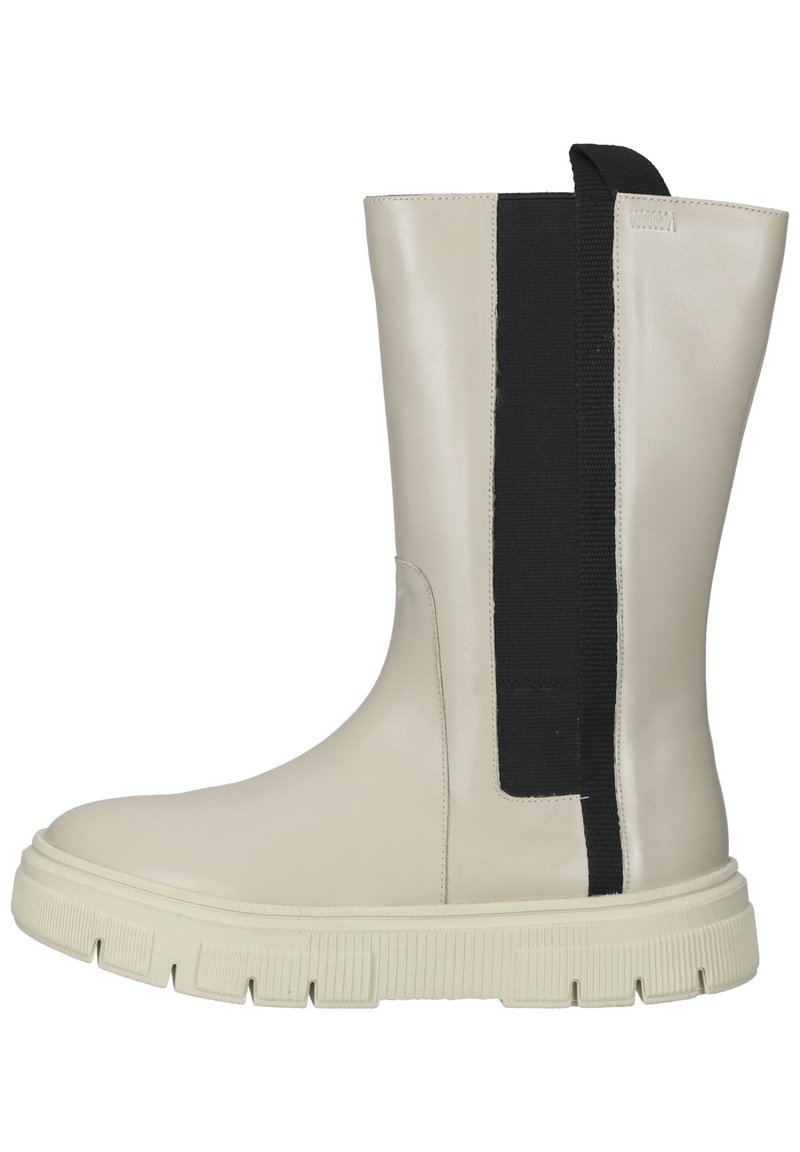 Bottine en cuir beige avec un panneau élastique noir. Caractéristiques d'une semelle en caoutchouc épaisse avec une texture antidérapante. Fini lisse et design élégant.
