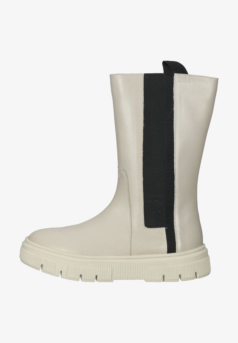 Beige leather ankle boot with a black elastic panel. Features a thick rubber sole with textured grip. Smooth finish and sleek design.
