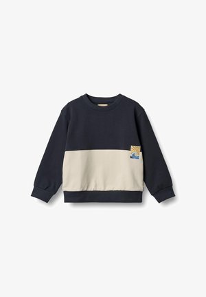 Marinblå och krämfärgad sweatshirt med långa ärmar, ribbade muddar och en logotyp i vågmönster. Mjuk bomullsblandning med en avslappnad passform.