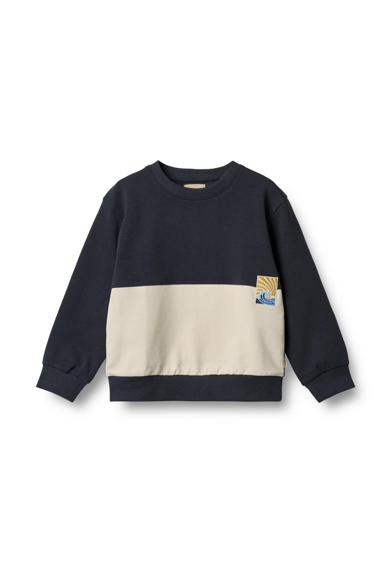 Sweatshirt bleu marine et crème à manches longues, avec des poignets côtelés et un patch logo en forme de vague. Mélange de coton doux avec une coupe décontractée.