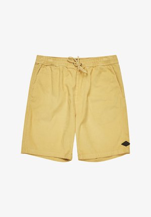 Gelbe Cordshorts mit elastischem Bund, Kordelzugverschluss und zwei Seitentaschen. Mit einem schwarzen Logo-Patch am unteren Saum.