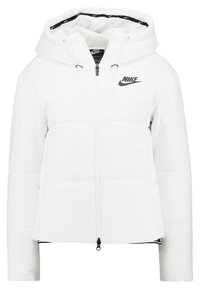 White puffer jacket with a hood, front zipper, and elastic hem. Features black Nike logo on the chest and textured sleeve panels.