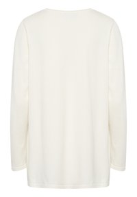 En enkel långärmad vit tröja med rund halsringning sedd bakifrån med en jämn, mjuk tygstruktur.