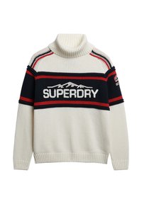 Pull à col roulé crème avec des rayures horizontales bleu marine et rouges. Présente le logo "SUPERDRY", un graphique de montagne, ainsi que des poignets et un ourlet côtelés.