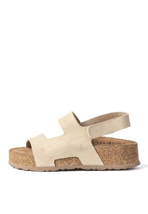 Sandalia de ante beige con punta abierta, tira trasera y suela de plataforma de corcho diseñada para comodidad y soporte.