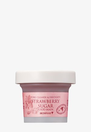 Petit pot de Skinfood Strawberry Sugar Food Mask avec couvercle blanc et étiquette rose pour le nettoyage des pores et l’exfoliation.