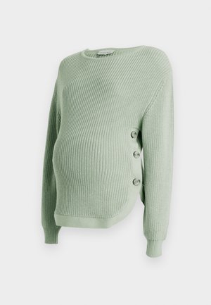 Maglione premaman in maglia verde chiaro con trama a coste, dotato di tre bottoni sul lato sinistro e maniche lunghe.