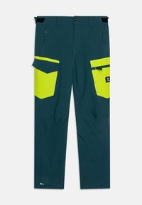 Τεχνικό παντελόνι εργασίας σε σκούρο τιρκουάζ με φωτεινές κίτρινες λεπτομέρειες. Διαθέτει πολλαπλές τσέπες και ενισχυμένες ραφές. Κατασκευασμένο από ανθεκτικό ύφασμα.