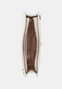 White leather clutch bag with a smooth texture, featuring two gold zippers and a brown fabric interior. Compact design with an organized layout.