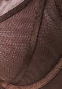 Hunkemöller - Biustonosz z fiszbiną