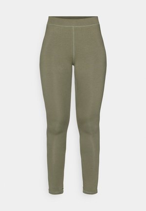 Olive-green leggings made of stretch fabric, featuring a smooth texture, high waistband, and fitted design with no visible seams.
