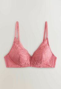 Braletă roz din dantelă cu bretele subțiri reglabile și model floral, așezată pe o suprafață deschisă la culoare.