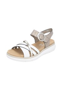 White and metallic silver sandal with crossed straps, a circle accent, and a light beige sole. Features a cushioned footbed for comfort.