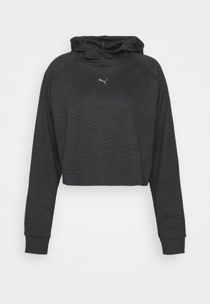 Sweat à capuche court noir avec manches longues et texture ondulée subtile, avec un petit logo Puma argenté sur la poitrine.