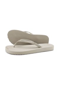 Beige flip-flop sandals with a textured outsole, featuring thin straps embellished with metallic accents for added detail.