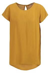Blouse à manches courtes, col rond, en jaune moutarde, fabriquée dans un tissu léger, avec une ouverture en clé à l'arrière et un ourlet arrondi.