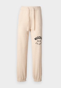 Bež trenirka z elastičnimi manšetami in pasom. Na levem stegnu se nahaja črn potiskan logotip "MOSCHINO 86 ❤ 23 JEANS". Mehka tekstura.